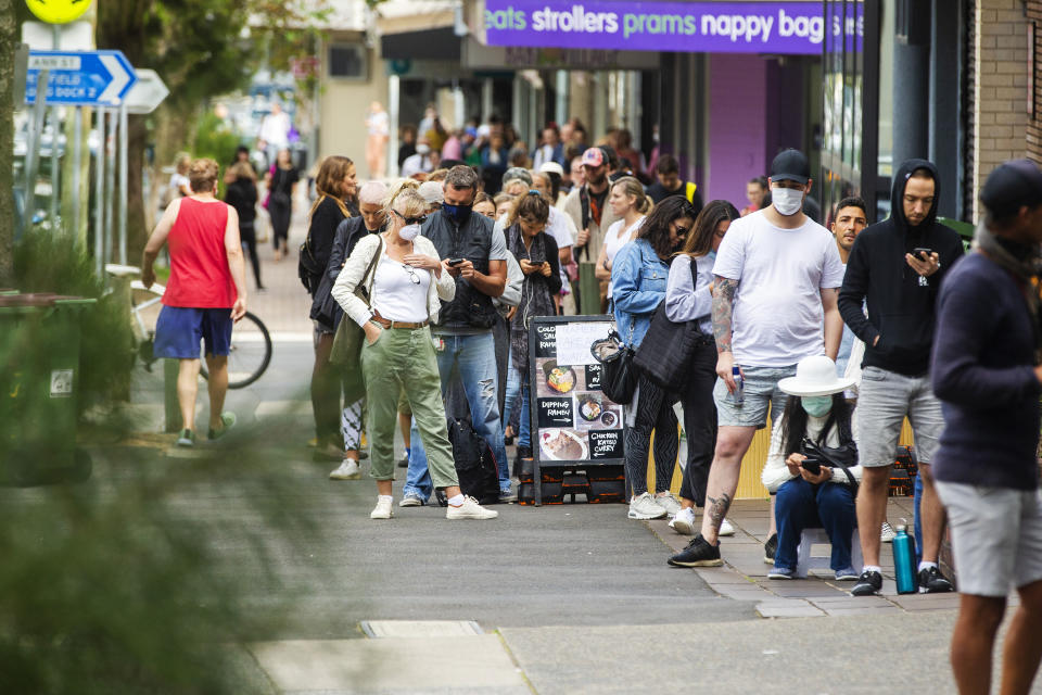 SYDNEY, AUSTRALIA - MARCH 23: People are seen lining up at Centrelink in Bondi Junction on March 23, 2020 in Sydney, Australia. From midday Monday, venues such as bars, clubs, nightclubs, cinemas, gyms and restaurants, along with anywhere people remain static would be closed. Schools remain open but parents have the option to keep children at home if they wish while Victoria is bringing forward school holidays from Tuesday. There are now 1353 confirmed cases of COVID-19 in Australia and the death toll now stands at seven. (Photo by Jenny Evans/Getty Images)