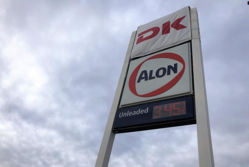 A cover with the DK store logo is over the 7-Eleven sign near the gas pumps at a former 7-Eleven branded convenience store at 10026 Montana Ave., in East El Paso, on Jan. 23. El Paso's 7-Eleven stores are being rebranded as DK stores, but Alon-branded gasoline will still be sold at the stores.