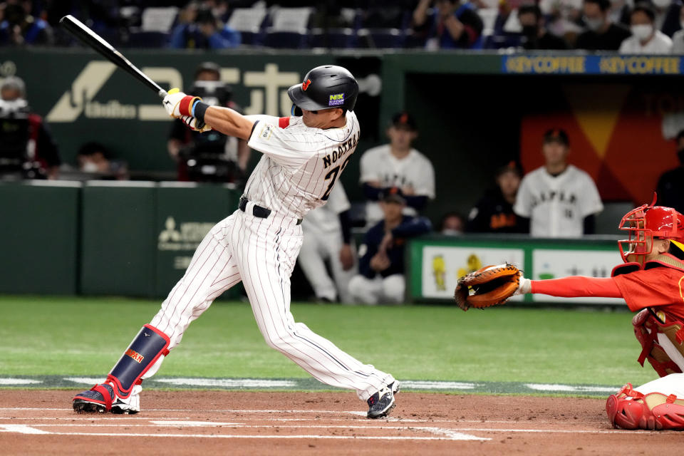 FILE - Lars Nootbaar of Japan hits a single against China in the first inning of the Pool B game at the World Baseball Classic (WBC) in Tokyo, Japan, March 9, 2023. Nootbaar's pepper-grinder gesture is catching on all across Japan, not just at the Tokyo Dome.(AP Photo/Eugene Hoshiko, File)