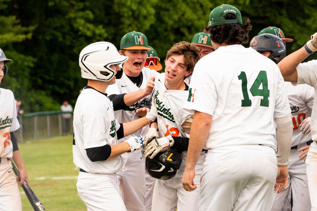 After hitting a grand slam in the fourth inning, Hopkinton left fielder Nick Pedroli celebrates with his teammates during the opening round of the Rich Pedroli Daily News Classic game in Natick against Franklin, May 25, 2023.