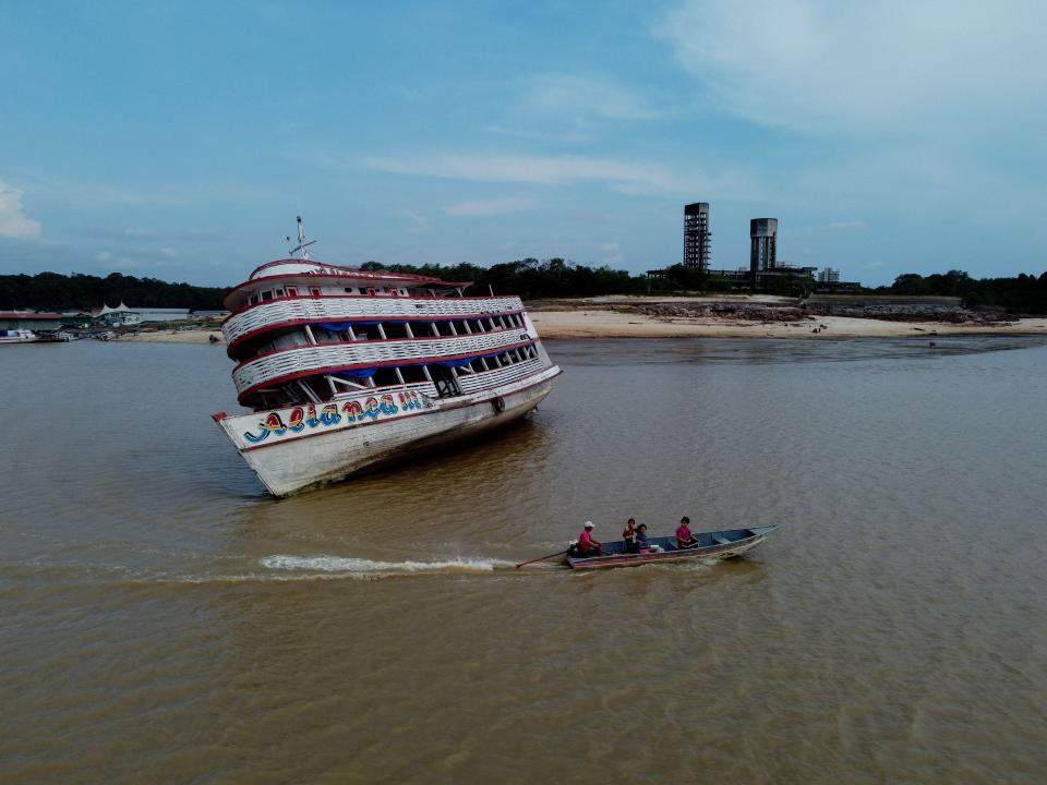 TOPSHOT - View of a stranded ferry boat  at the Marina do Davi, a docking area of the Negro river, city of Manaus, Amazonas State, northern Brazil, on October 16, 2023. The Negro river is facing the worst dry season of the last decades in the Amazon rainforest. (Photo by MICHAEL DANTAS / AFP) (Photo by MICHAEL DANTAS/AFP via Getty Images)