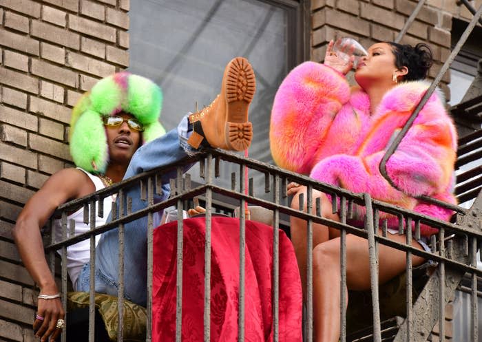 A$AP Rocky and Rihanna are pictured on a fire escape in New York City while filming a music video in July 2021
