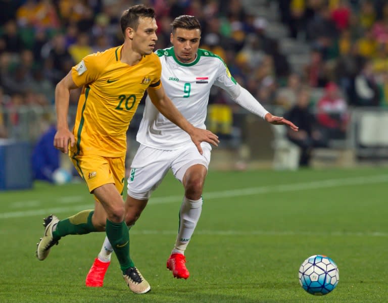 Australia's Trent Sainsbury (left) battles for the ball with Iraq's Ahmed Yasin during their World Cup qualifier in Perth on September 1, 2016