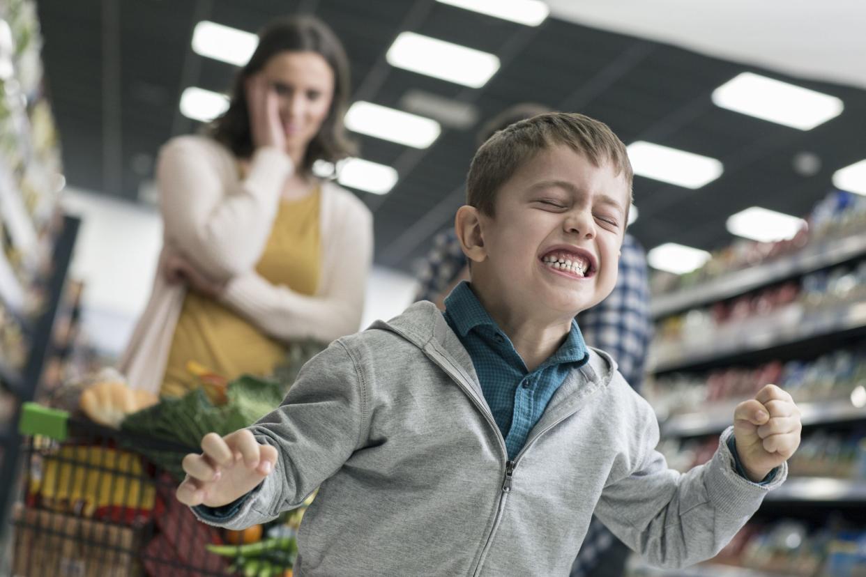 Naughty boy in supermarket