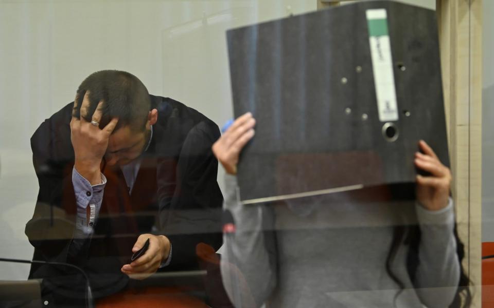 MUNICH, GERMANY - OCTOBER 13: Jennifer W. arrives with her lawyer Ali Aydin for what is likely one of the last days of her trial over her responsibility in the death of a young Yazidi girl while Jennifer W. was a follower of the Islamic State in Syria on October 13, 2021 in Munich, Germany. While prosecutors have demanded a life-long sentence, observers are expecting a much lighter sentence, as the court has been unable to prove the circumstances around the death of the girl, who Jennifer W. and her husband kept as a slave. Jennifer W. joined the Islamic State after falling in love with an IS fighter in Germany and lived in Syria during 2015. Her husband is currently on trial in Frankfurt on charges of crimes against humanity. (Photo by Sebastian Widmann/Getty Images) - Sebastian Widmann /Getty Images Europe 