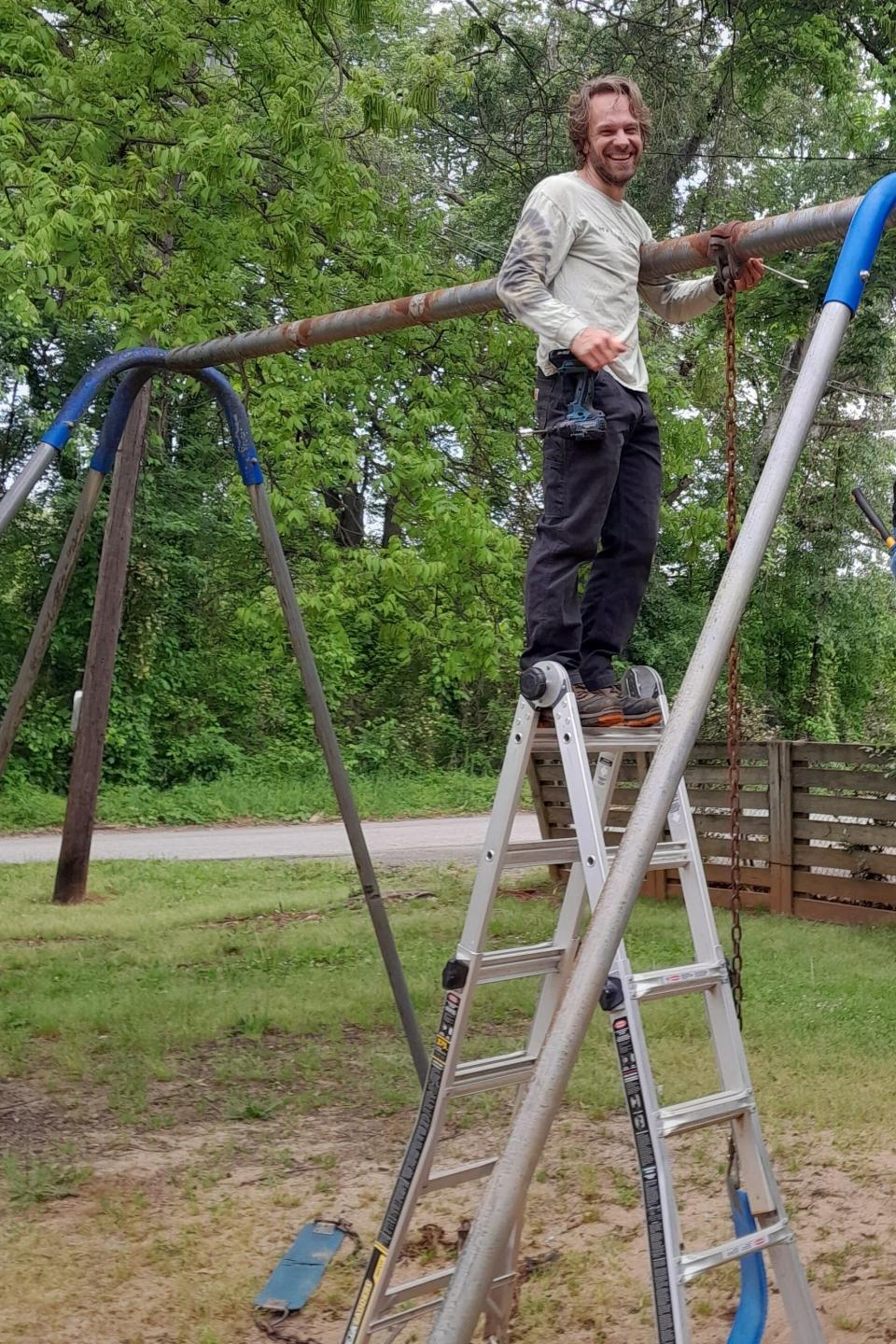 Tee Thompson replaces chains and swings at Verner Springs Park in the Sans Souci neighborhood.