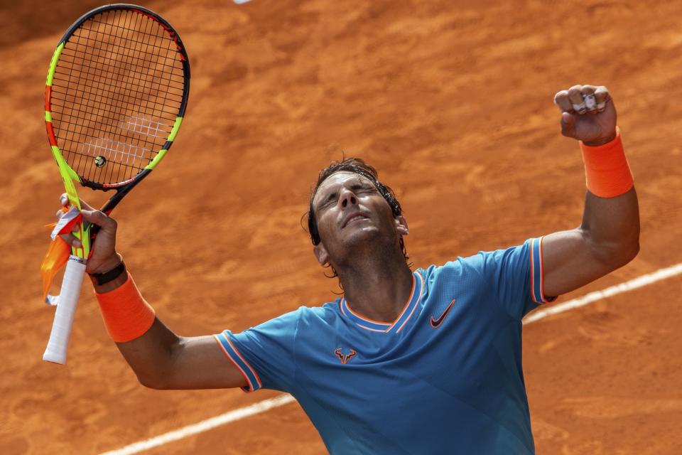 Rafael Nadal, from Spain, celebrates after winning Felix Auger-Aliassime, from Canada, during the Madrid Open tennis tournament in Madrid, Wednesday, May 8, 2019. (AP Photo/Bernat Armangue)