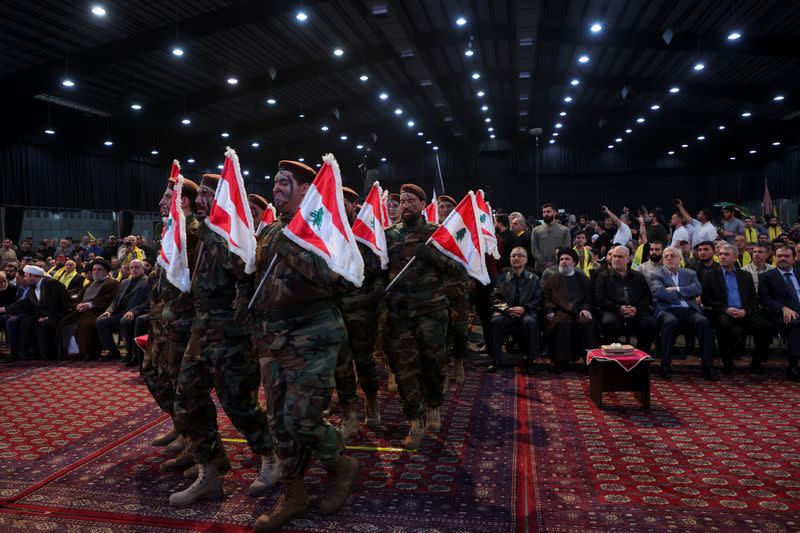 Hezbollah members parade during a rally marking al-Quds Day in Beirut's southern suburbs