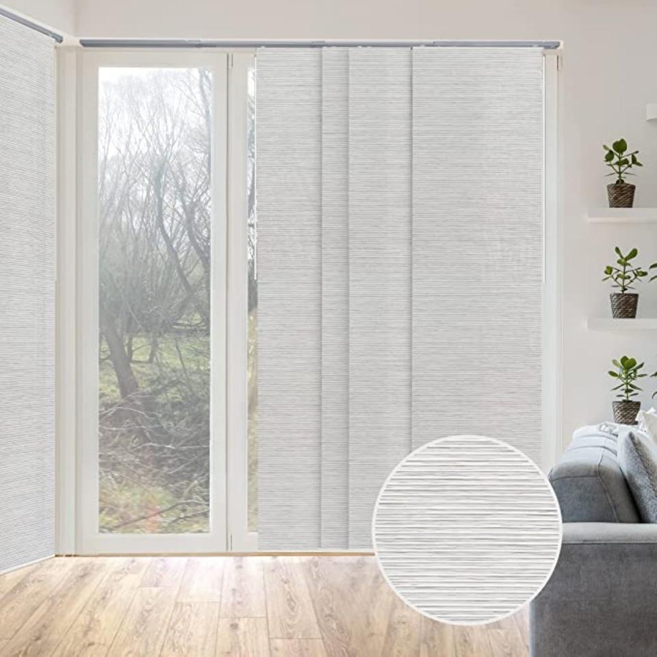 White panel blinds over a sliding glass door