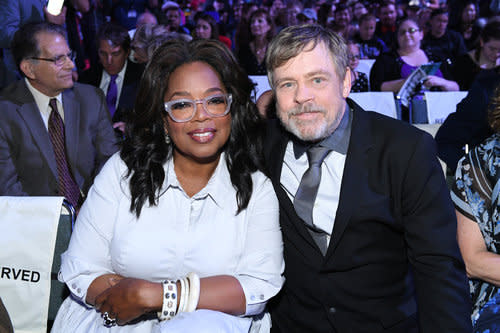 <p>The two entertainers cozy up in the audience ahead of the ceremony in which both would be enshrined as Disney Legends. (Photo: Disney) </p>