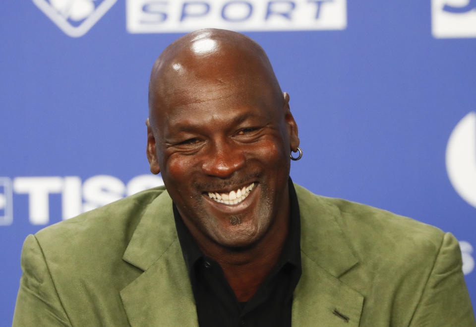 FILE - Basketball legend Michael Jordan speaks during a press conference ahead of an NBA basketball game between the Charlotte Hornets and Milwaukee Bucks in Paris, Jan. 24, 2020. The Charlotte Hornets have two picks in the first round of the NBA draft on Thursday June 23, 2022 — and no head coach in place to help facilitate those decisions. Hornets owner Michael Jordan is still searching for the organization’s next coach after Golden State Warriors assistant Kenny Atkinson on Saturday abruptly backed out of a four-year agreement to coach the team. (AP Photo/Thibault Camus, File)