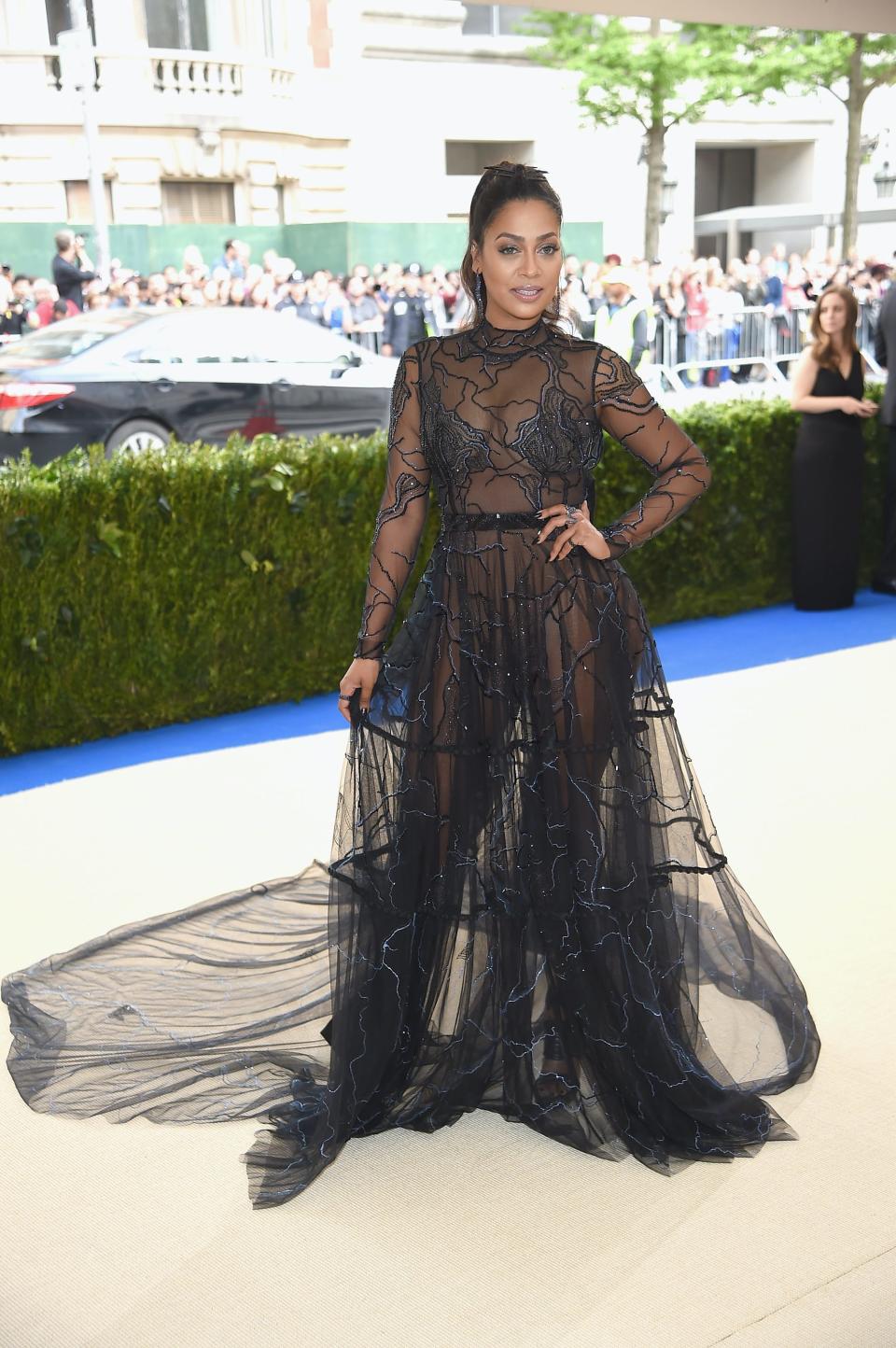 Lala Anthony wears a black, see through dress at the 2017 Met Gala.