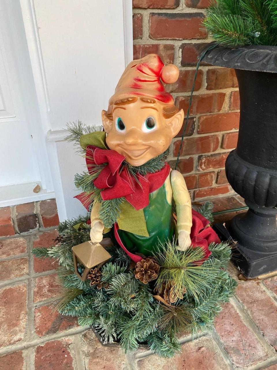 Bud the elf is spending his 60th Christmas on Mary Nell and Jerry Ferguson’s porch. A big wind sent him flying one year but a neighbor collected the pieces and the Fergusons put him back together.