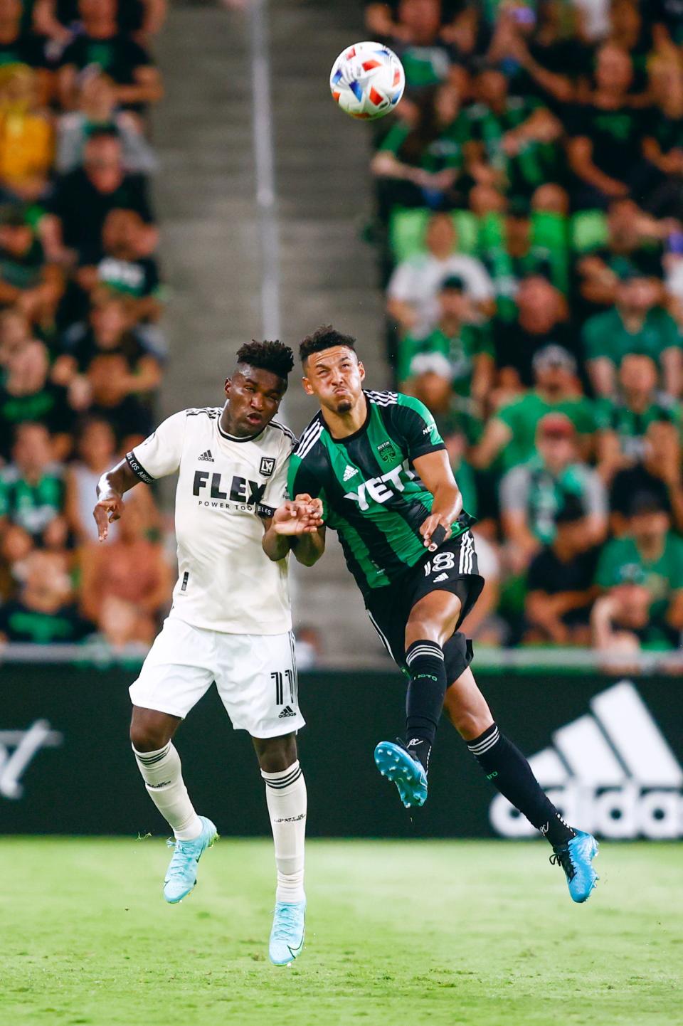 Austin FC's Julio Cascante, right, goes up for a header against LAFC midfielder Jose Cifuentes during last July's match at Q2 Stadium, a 2-0 LAFC win. Cascante, who hasn't played since El Tree's season opener because of an injury, is training with a ball again, head coach Josh Wolff said this week.