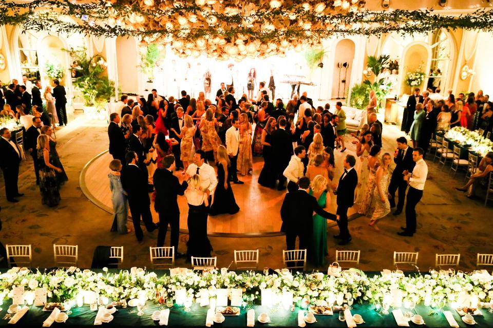 The bride wore Oscar de la Renta, inspired by her grandmother, for her greenery-filled ceremony at the Beverly Hills Hotel.