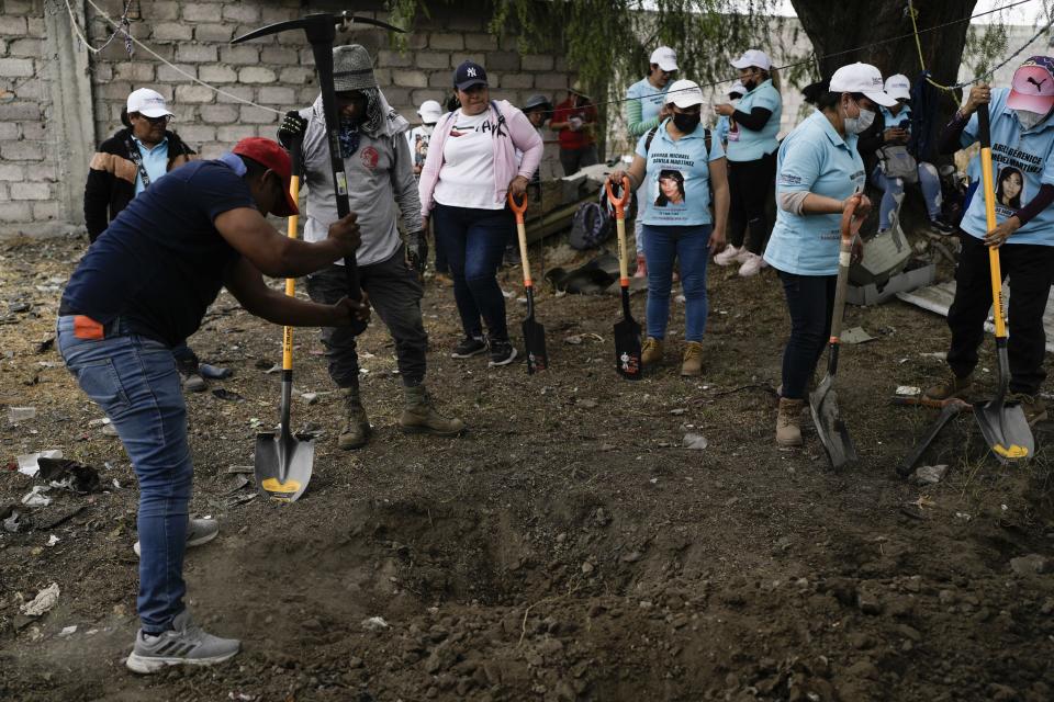 Relatives search for their missing loved ones in a clandestine grave in Zumpango, Mexico, Friday, April 19, 2024. Hundreds of collectives searching for missing loved ones fanned out across Mexico on Friday as part of a coordinated effort to raise the profile of efforts that are led by the families of the tens of thousands of missing across Mexico without support from the government. (AP Photo/Marco Ugarte)