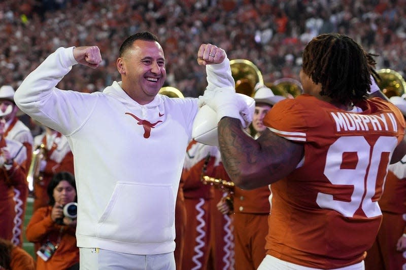 Texas head coach Steve Sarkisian greets Texas Longhorns defensive lineman Byron Murphy II before last year's game against Texas Tech. Sarkisian reeled in a pledge from elite edge rusher Smith Orogbo on Monday; the Longhorns' 2025 recruiting class is currently ranked No. 17.