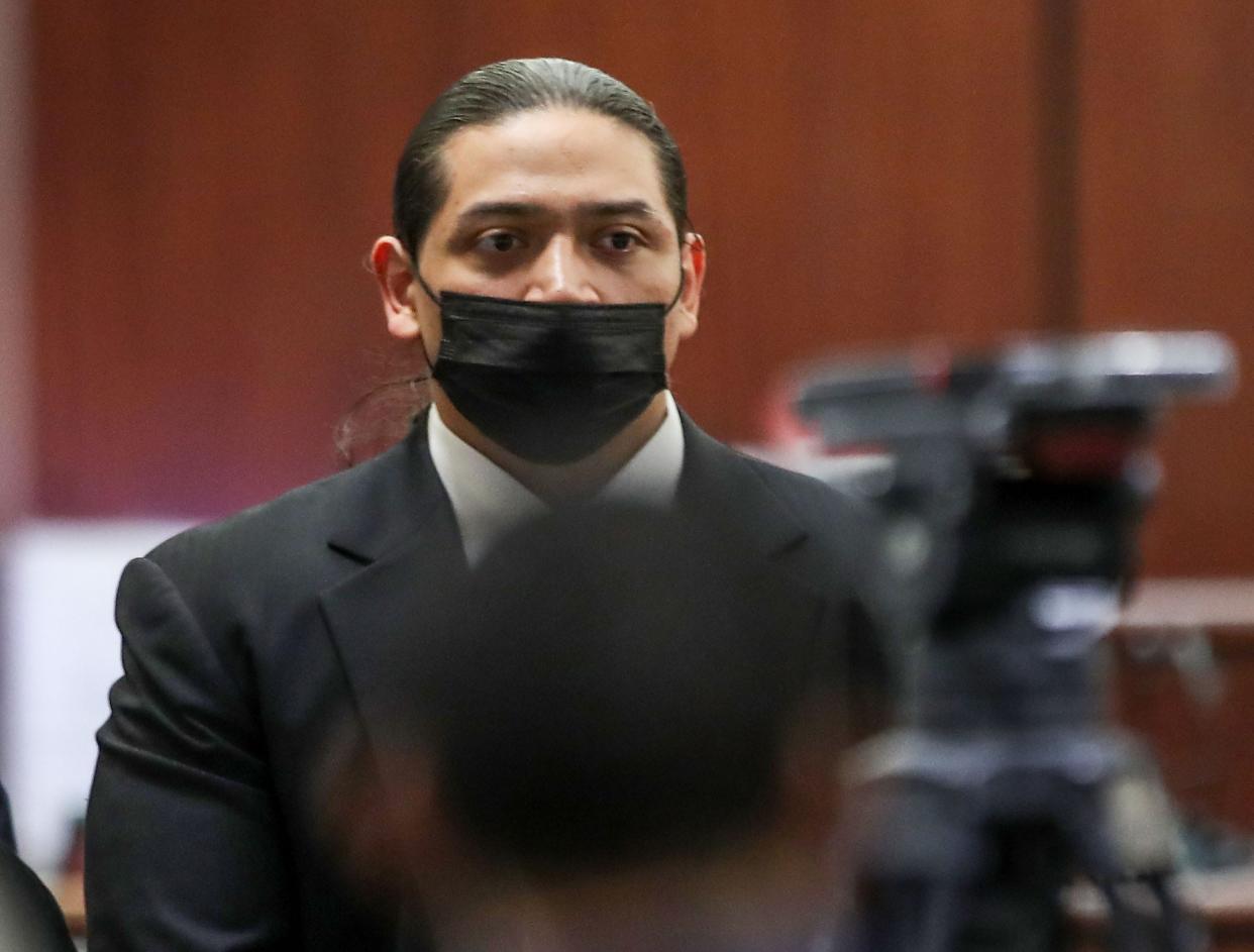 Jose Vladimir Larin Garcia looks on as the courtroom breaks for a recess during his quadruple homicide trial at the Larson Justice Center in Indio, November 29, 2021.  Garcia stands accused of murder in the deaths of four young people in Palm Springs in February of 2019.