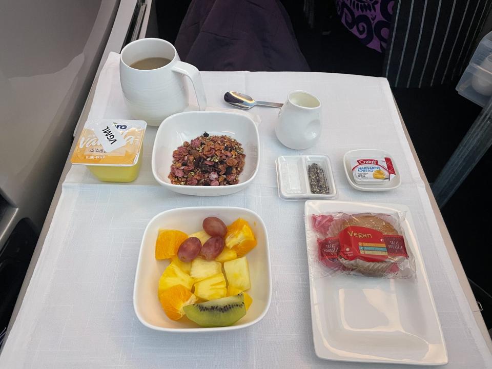 Food on a business-class tray table.