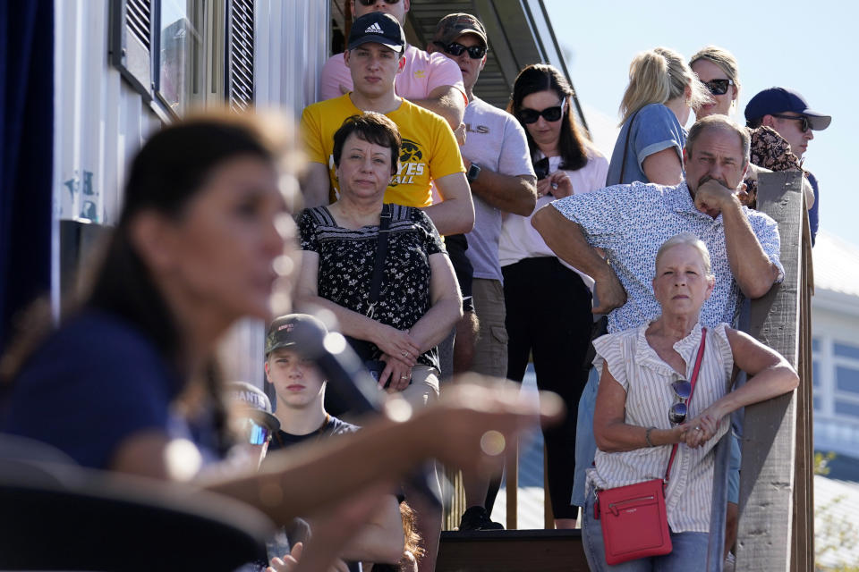 FILE - People stand on stairs to listen as Republican presidential candidate former U.N. Ambassador Nikki Haley speaks during a Fair-Side Chat with Iowa Gov. Kim Reynolds at the Iowa State Fair, Saturday, Aug. 12, 2023, in Des Moines, Iowa. (AP Photo/Jeff Roberson, File)