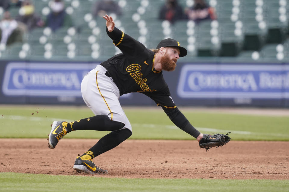 Pittsburgh Pirates first baseman Colin Moran fields the grounder hit by Detroit Tigers' Willi Castro during the third inning of a baseball game, hursday, April 22, 2021, in Detroit. (AP Photo/Carlos Osorio)