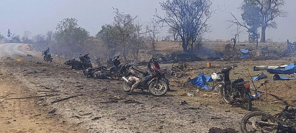 This photo provided by the Kyunhla Activists Group shows aftermath of an airstrike in Pazigyi village in Sagaing Region's Kanbalu Township, Myanmar, Tuesday, April 11, 2023. Witnesses and independent media reports said dozens of villagers in central Myanmar have been killed in an air attack carried out Tuesday by the Southeast Asian country's military government. (Kyunhla Activists Group via AP)