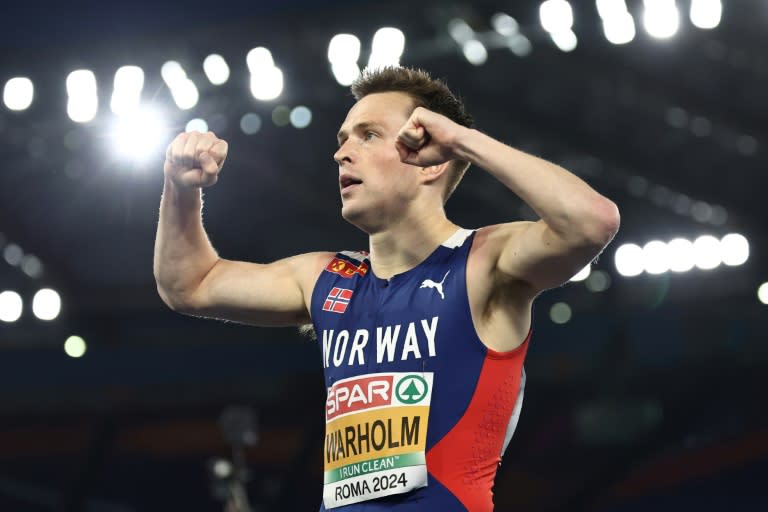 Karsten Warholm celebrates winning gold at the European Athletics Championships in June (Anne-Christine POUJOULAT)