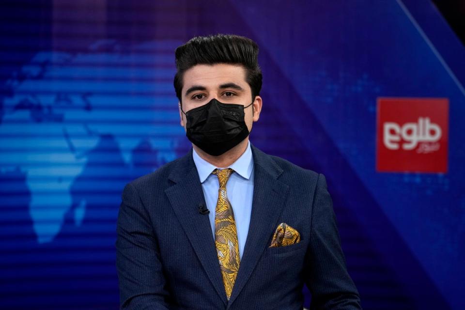 TOLOnews TV anchor Nesar Nabil wears a face mask to protest the Taliban’s new order that female presenters cover their faces on air (AP)