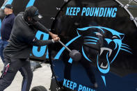 Carolina Panthers first round draft pick Xavier Legette beats the team drum before for an NFL football press conference on Friday, April 26, 2024, in Charlotte, N.C. (AP Photo/Chris Carlson)