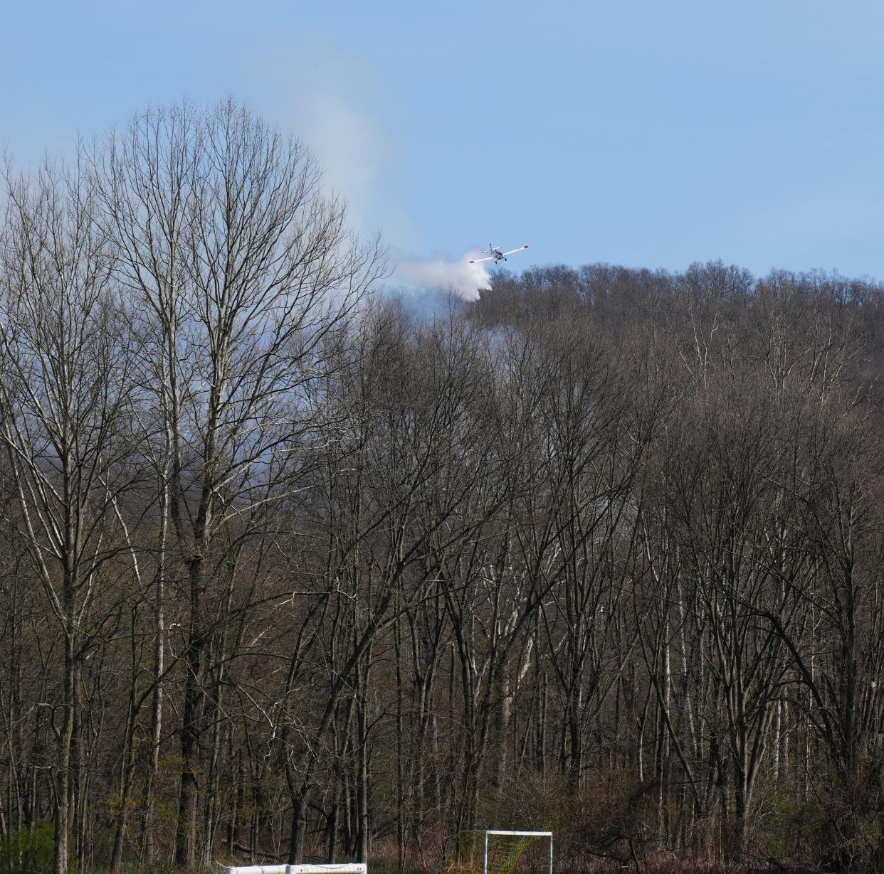 Smoke rises from a wildfire as seen from the Pennsylvania side of the Delaware River just upstream from the head of Shawnee Island. The fire was confined to a five-acre area within Worthington State Forest and was brought under control by crews from the New Jersey Forest Fire Service and the National Park Service.