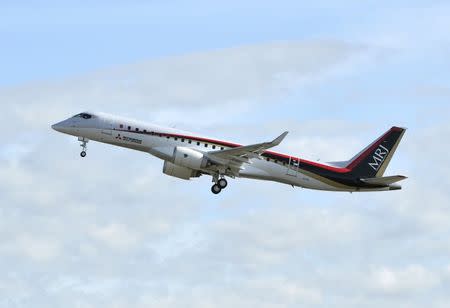 Mitsubishi Aircraft Corp's Mitsubishi Regional Jet (MRJ) takes off for a test flight at Nagoya Airfield in Toyoyama town, Aichi Prefecture, central Japan, in this photo taken by Kyodo November 11, 2015. Mandatory credit REUTERS/Kyodo