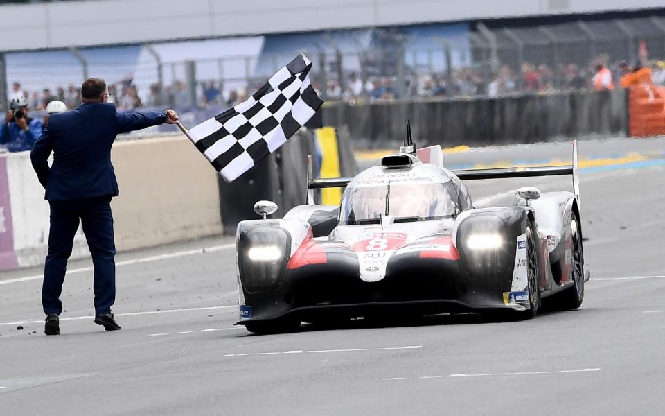 TOPSHOT - Toyota TS050 Hybrid LMP1 of Japanese's driver Kazuki Nakajima crosses the finish line to win the 87th edition of the 24 Hours Le Mans endurance race on June 16, 2019, at Le Mans northwestern France. - (Photo by Fred TANNEAU / AFP) (Photo credit should read FRED TANNEAU/AFP/Getty Images) *** BESTPIX ***  - FRED TANNEAU/AFP/Getty Images