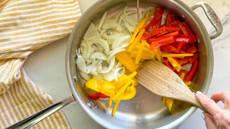 onion and peppers in pan