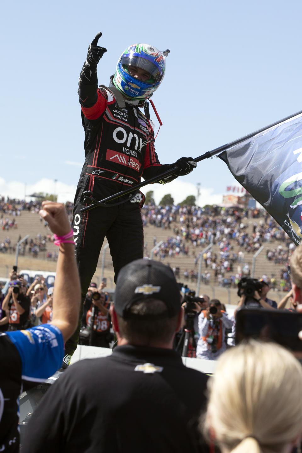 Daniel Suarez stands atop his car after winning a NASCAR Cup Series auto race, Sunday, June 12, 2022, at Sonoma Raceway in Sonoma, Calif. (AP Photo/D. Ross Cameron)