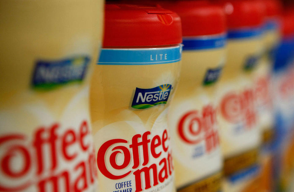 Coffee creamers in a grocery aisle.