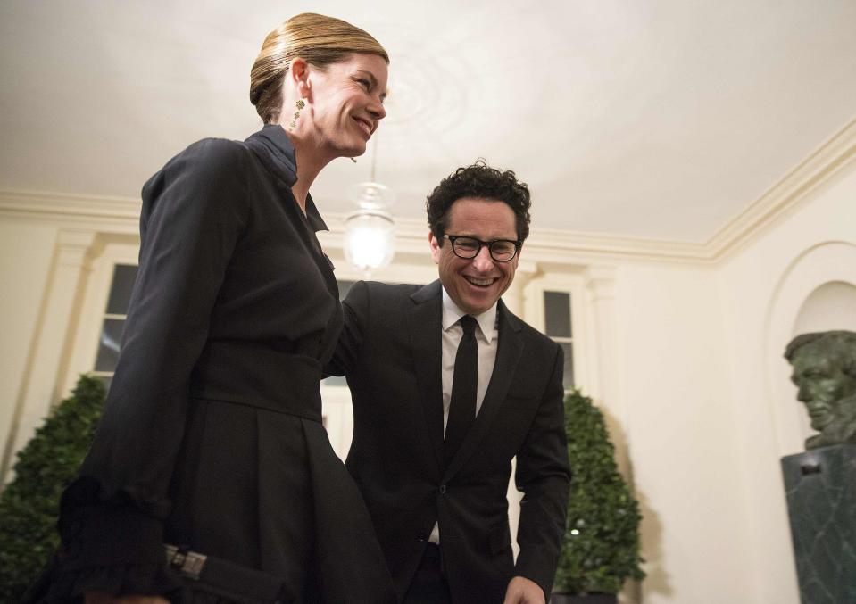 Director J.J. Abrams and wife, actress Katie McGrath arrive for the State Dinner being held for French President Francois Hollande at the White House in Washington February 11, 2014. (REUTERS/Joshua Roberts)