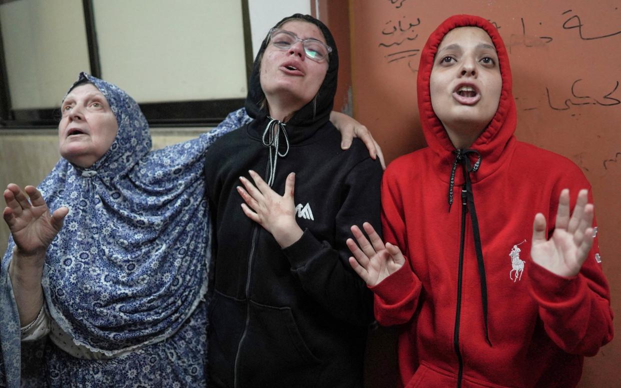 Palestinian women lament as relatives receive treatment after Israeli bombardment at Al-Aqsa Hospital in Deir el-Balah, central Gaza.