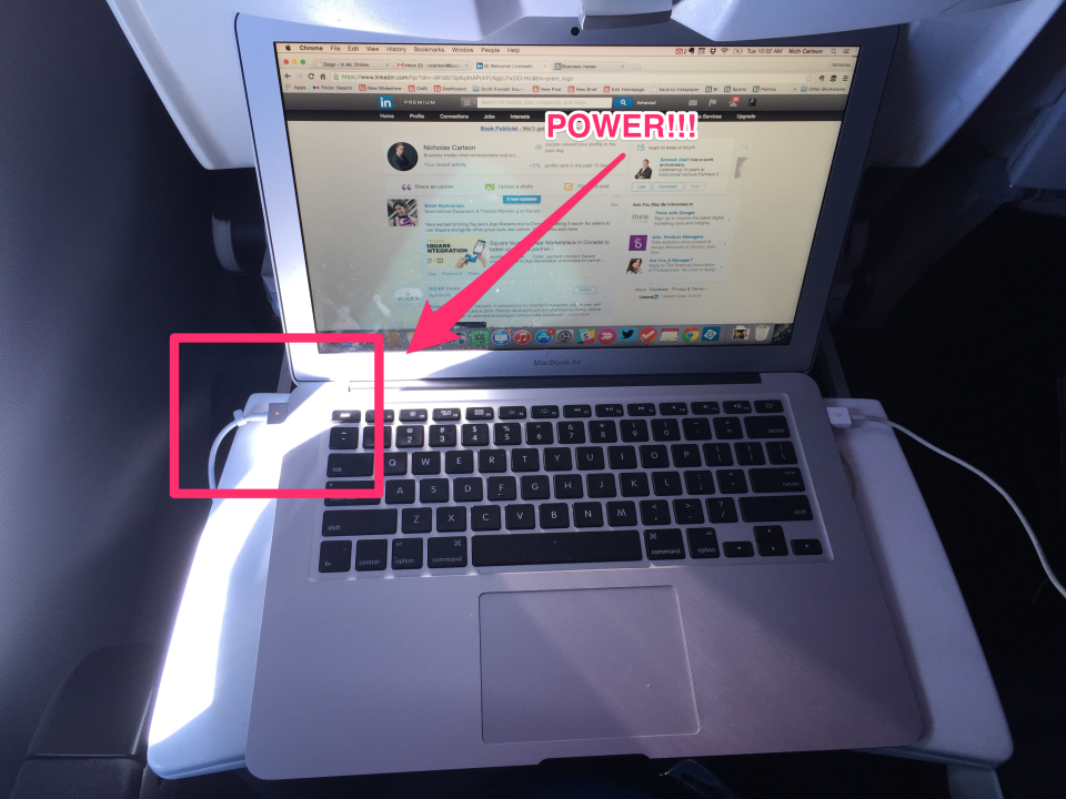 Plugged-in laptop on a Virgin America flight