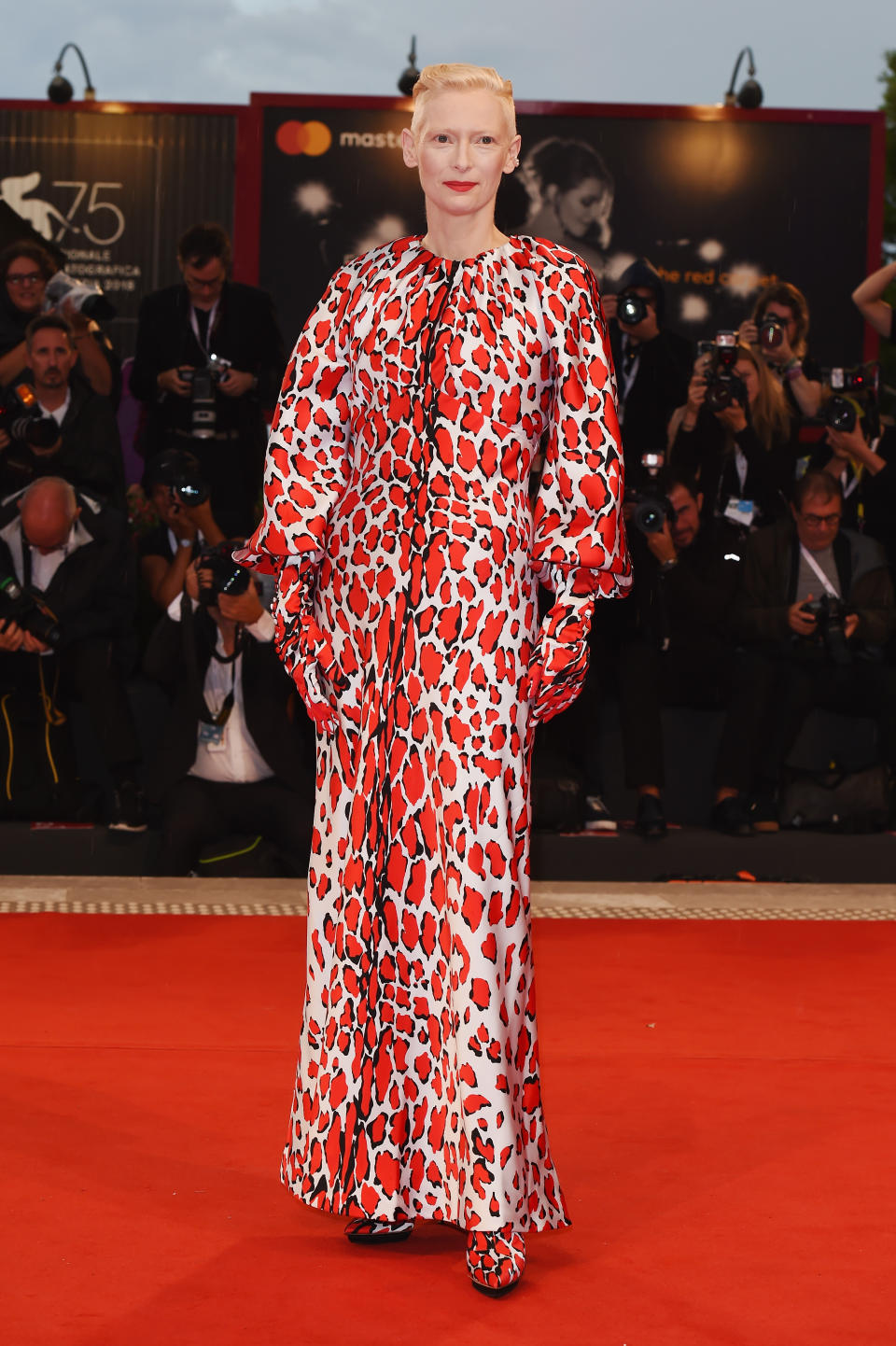 <p>Tilda’s red, animal print Schiaparelli look – complete with gloves and matching heels – certainly stood out. <em>[Photo: Getty]</em> </p>
