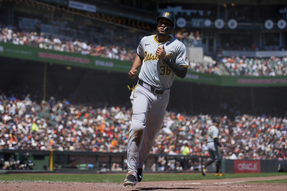 Pittsburgh Pirates' Edward Olivares scores against the San Francisco Giants on Jared Triolo's ground out during the fifth inning of a baseball game Sunday, April 28, 2024, in San Francisco. Edward Olivares scored on the play. (AP Photo/Godofredo A. Vásquez)