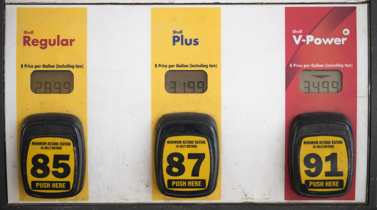 The per-gallon prices are illuminated on a gasoline pump at a Shell station Saturday, Dec. 23, 2023, in Denver. As Americans take to the road for the Christmas holiday, gasoline prices have swung upward in the past week after a months-long decline in the cost at the pump. (AP Photo/David Zalubowski)