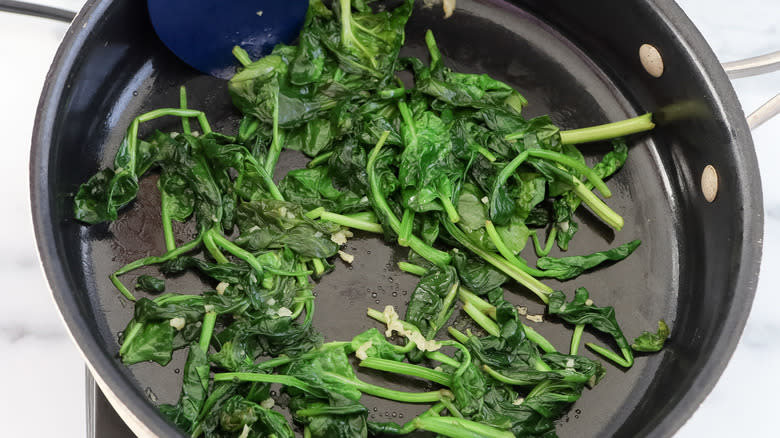 wilted spinach in skillet