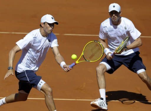 US brothers Mike (R) and Bob Bryan return the ball to Spain's Marcel Granollers and Marc Lopez during their Davis Cup semi-final doubles match at the Hermanos Castro park court in Gijon, northern Spain. The Bryan's won 6-3, 3-6, 7-5, 7-5