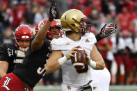Boston College quarterback Dennis Grosel (6) is sacked by Louisville defensive lineman Ryheem Craig (32) during the first half of an NCAA college football game in Louisville, Ky., Saturday, Oct. 23, 2021. (AP Photo/Timothy D. Easley)