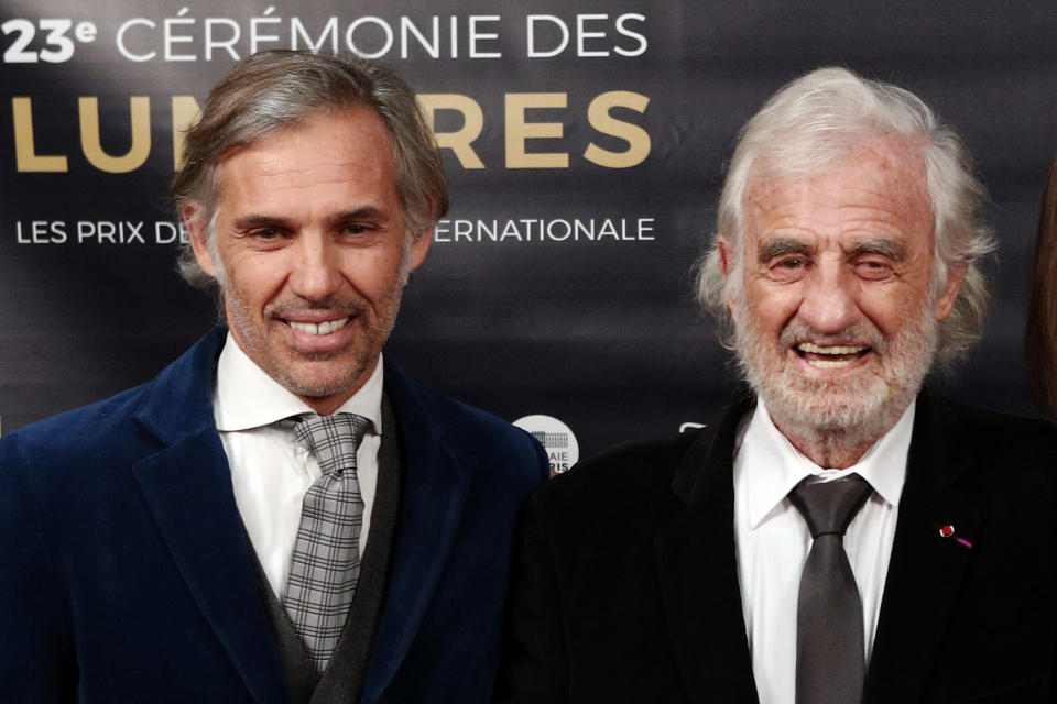 FILE - In this Feb. 5, 2018 file photo, French actor Jean-Paul Belmondo, right, and his son Paul Belmondo pose during a photocall prior to the 23rd Lumieres awards ceremony in Paris. French New Wave actor Jean-Paul Belmondo has died, according to his lawyer’s office on Monday Sept. 6, 2021. (AP Photo/Francois Mori, File)