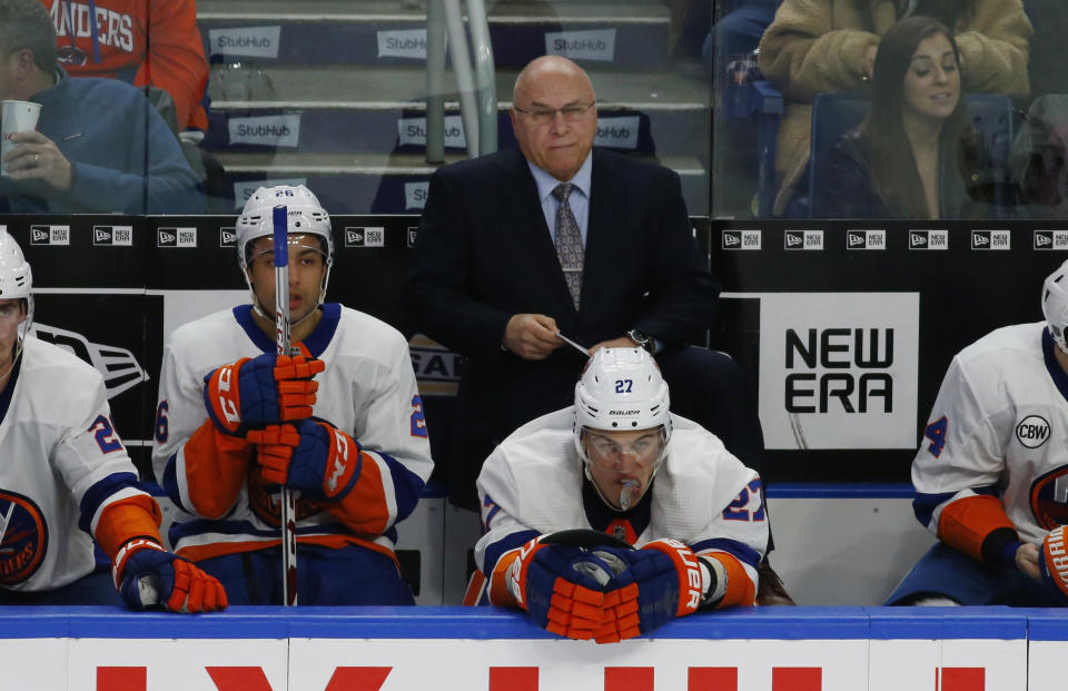 New York Islanders head coach Barry Trotz, top center, watches the third period of an NHL hockey game against the Buffalo Sabres, Monday, Dec. 31, 2018, in Buffalo N.Y. (AP Photo/Jeffrey T. Barnes)