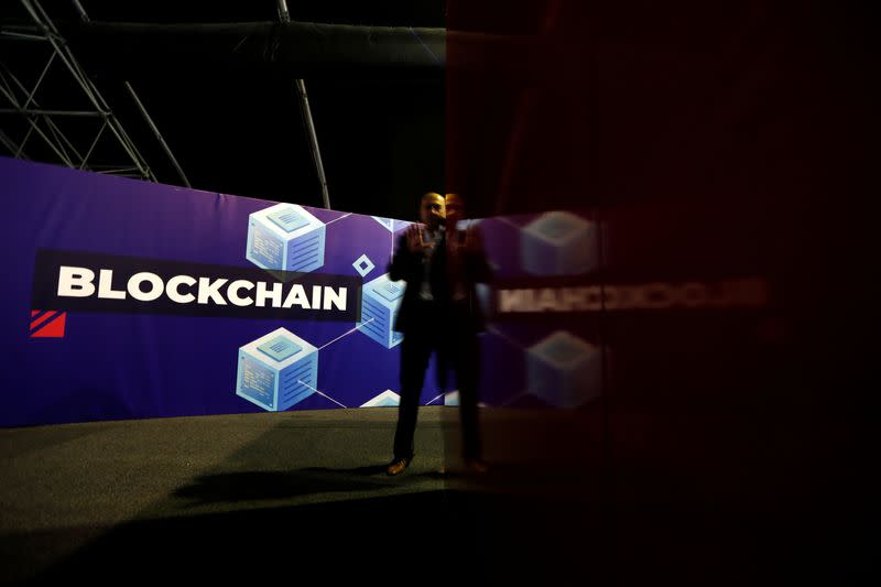 A delegate talks on his phone at the Delta Summit, Malta's official Blockchain and Digital Innovation event promoting cryptocurrency, in Ta' Qali