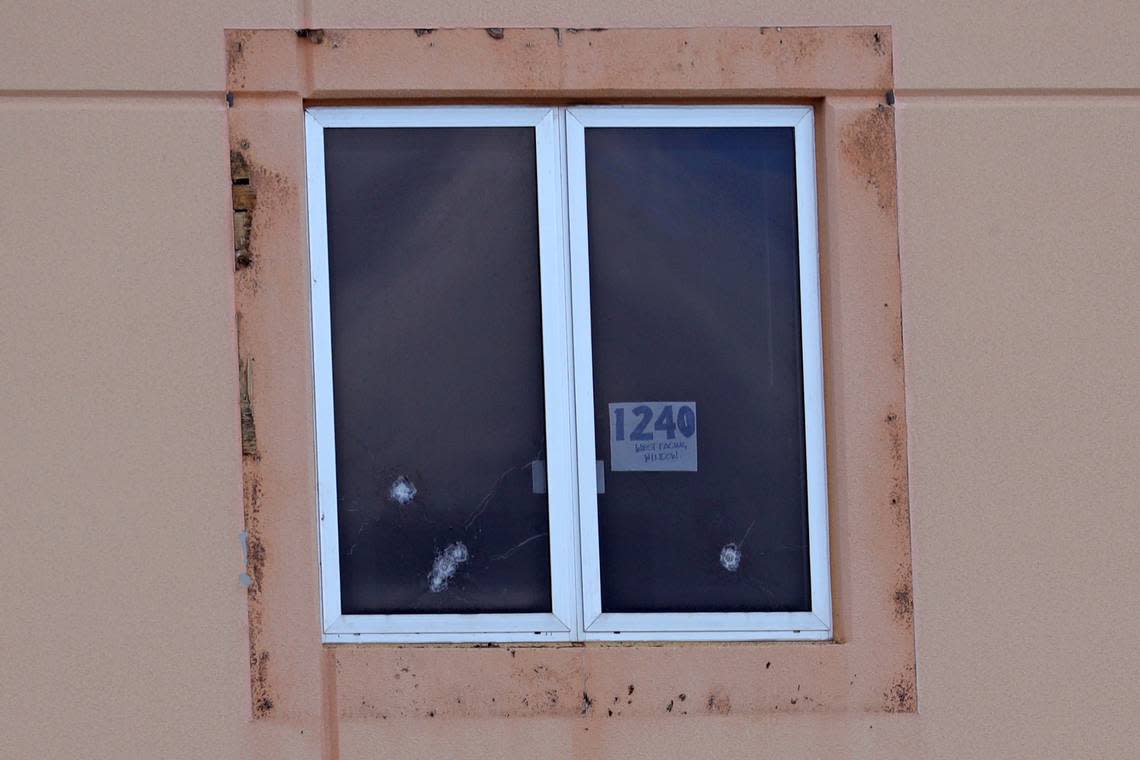 A sign reading “1240 west facing window” and five bullet holes can be seen in a third floor window of the crime scene where the 2018 shootings took place, at Marjory Stoneman Douglas High School in Parkland. Jurors toured the site on Thursday, Aug. 4, 2022.