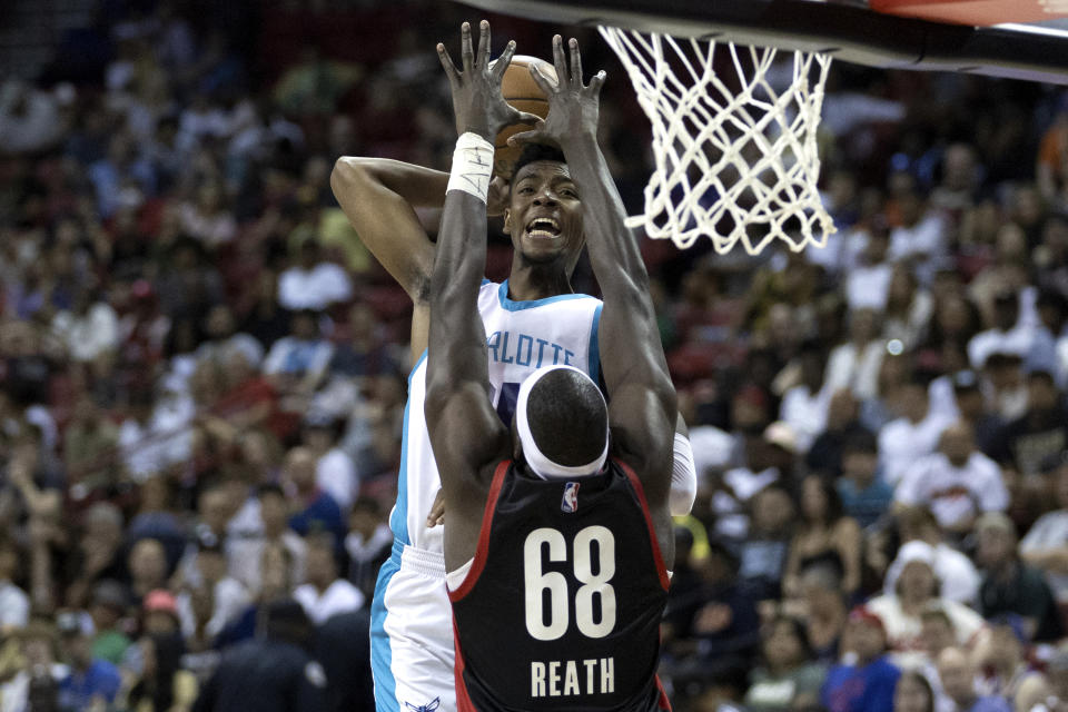 Charlotte Hornets forward Brandon Miller shoots against Portland Trail Blazers center Duop Reath (68) during an NBA summer league basketball game Tuesday, July 11, 2023, in Las Vegas. (Ellen Schmidt/Las Vegas Review-Journal via AP)