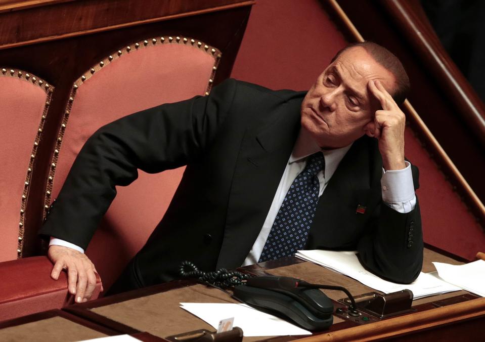 Italian centre-right leader Silvio Berlusconi looks on at the Senate in Rome, in this October 2, 2013 file photo. Coupled with a likely ouster from parliament after a criminal conviction, a mutiny among Berlusconi's most senior lieutenants that thwarted his attempt to topple the government has left the 77-year-old facing the most serious challenge to his authority in 20 years and is pushing Italy's most dominant post-war leader into the sunset of his career, friends and colleagues say. To match Insight ITALY-BERLUSCONI/ REUTERS/Tony Gentile/Files (ITALY - Tags: POLITICS)